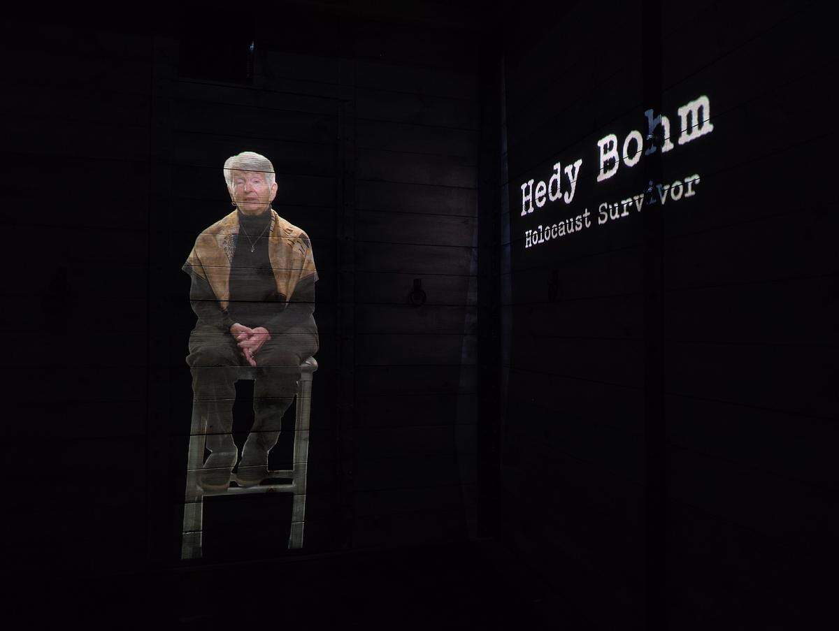 Hedy Bohm, a Holocaust survivor, is one of two narrators for the cattle car experience.