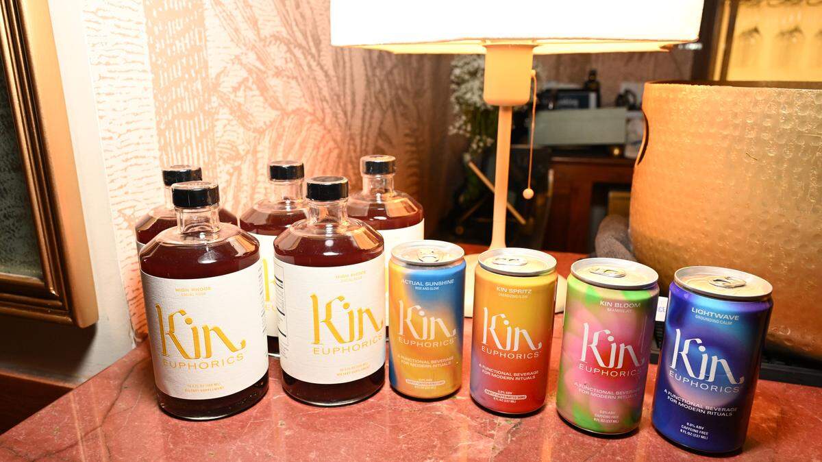 Kin Euphorics cans and bottles on a table.