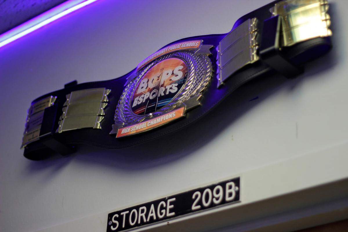 Coral Springs High School currently holds the championship belt from the Broward County Public Schools’ e-sports championship. It hangs on one wall of Jason Freedman’s classroom, along with other awards the program has achieved.
