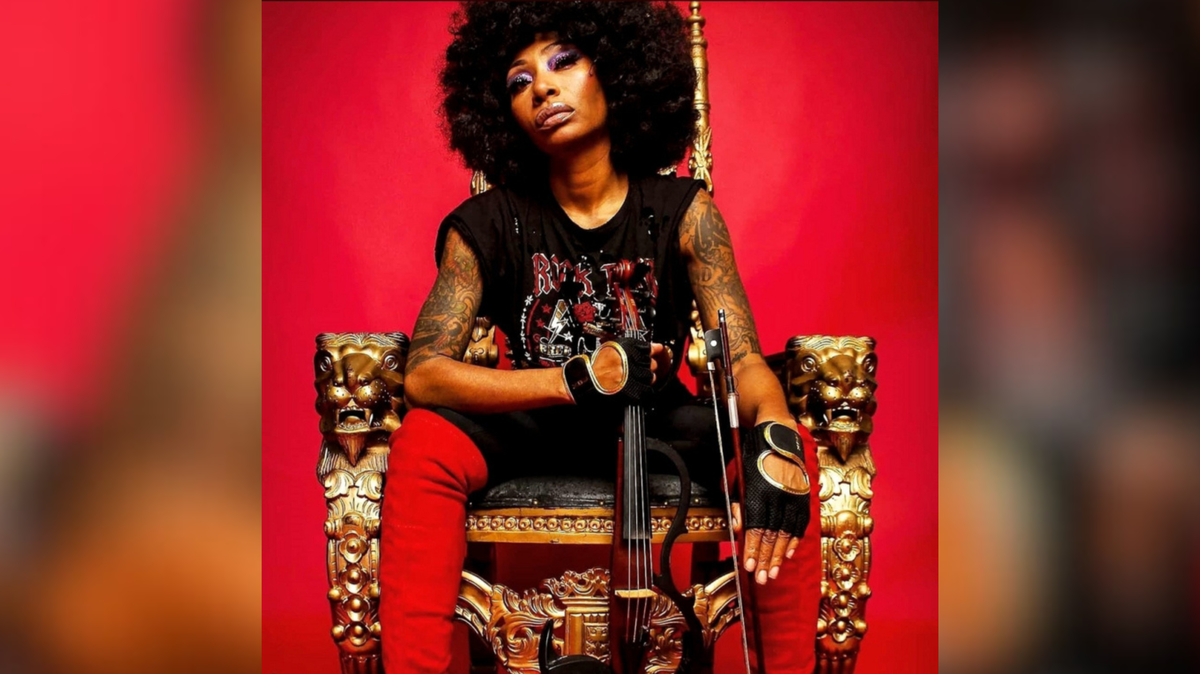 Black woman with afro, punk band t-shirt, unconventional violin set on bright red background