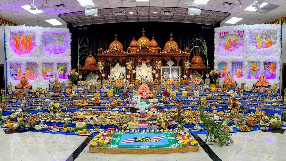 Vegetarian dishes are set out in the temple as offerings during Diwali. The food is later distributed throughout the community.