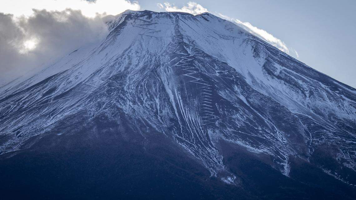 Mount Fuji is seen covered in snow in Yamanakako