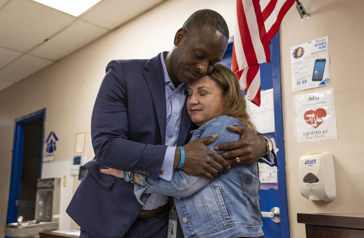 Broward County Schools Superintendent Howard Hepburn hugs School Board Member Lori Alhadeff after a moment of reflection held at Ramblewood Elementary School as they participate in a day of commemoration honoring the victims of the Marjory Stoneman Douglas High School tragedy on Friday, Feb. 13, in Coral Springs.