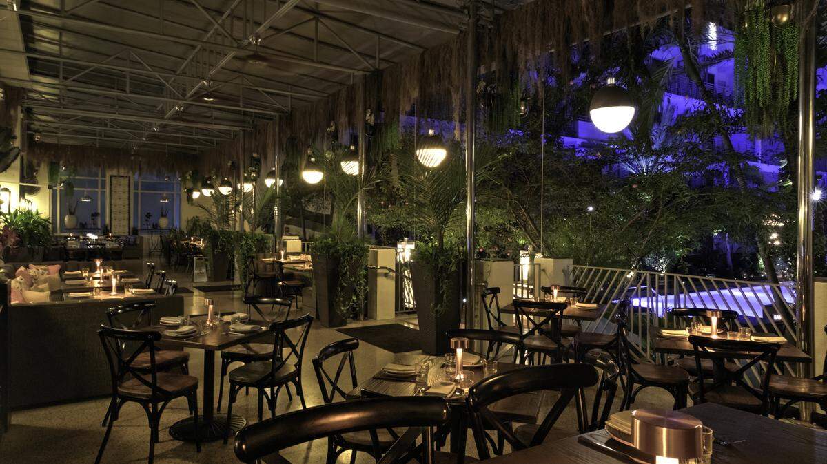 Dining tables and chairs let on the partio of Mareva1939 in Miami.