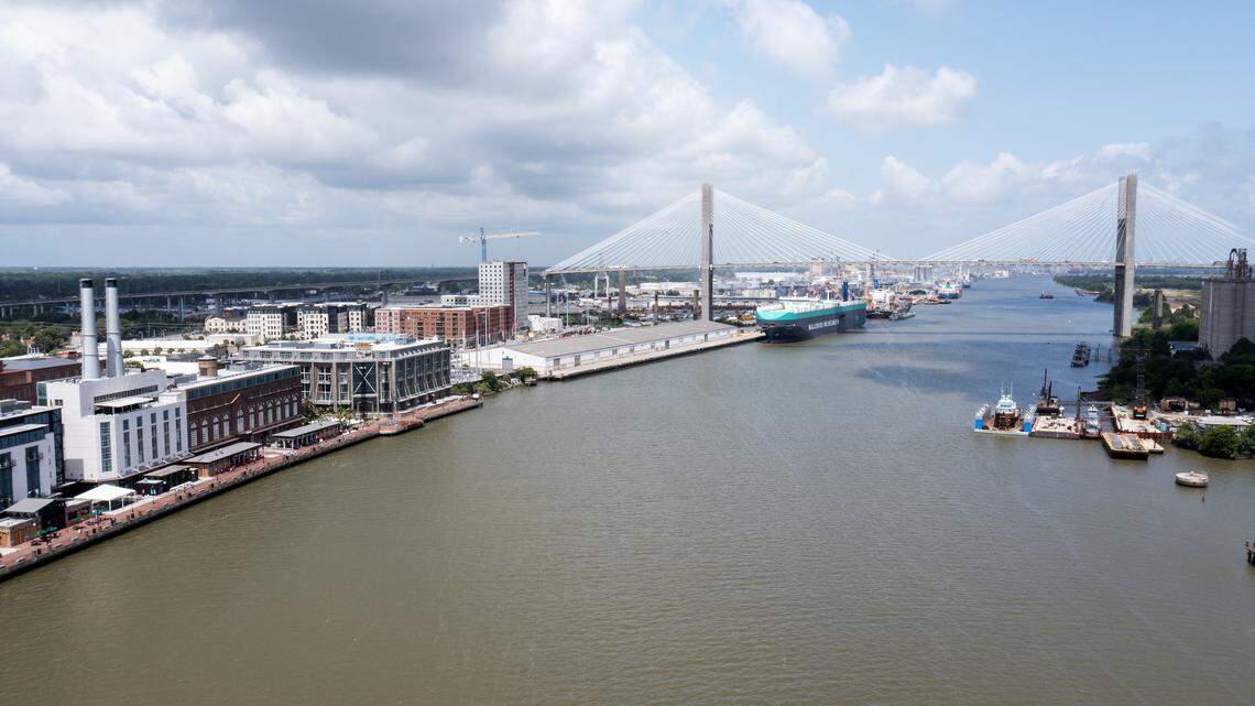 An aerial photo of the Historic Downtown waterfront with the Talmadge Memorial Bridge in the background in Savannah, Georgia.