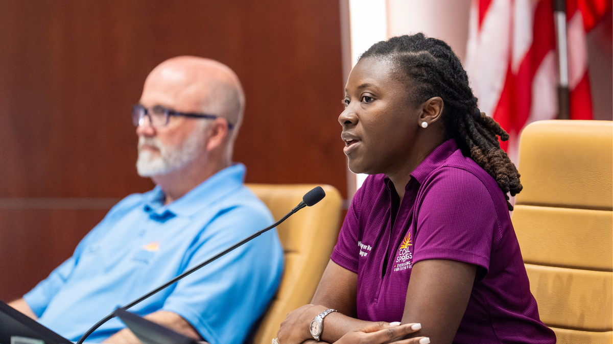 Former Coral Springs vice mayor Nancy Metayer, right, speaks at a City Commission meeting. A month and a half after she was shot and killed, her mother has filed to run for her now-empty seat.