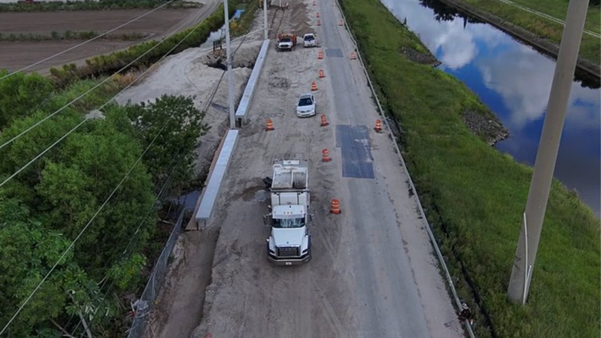 A drone shot of partially-completed work on Lox Road showing workers’ progress on drainage, road widening and resurfacing.