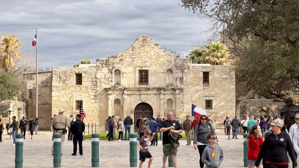 Tourists gather in front of the chapel of the Alamo Mission, known as the “Shrine of Texas Liberty”, in downtown San Antonio Texas.
