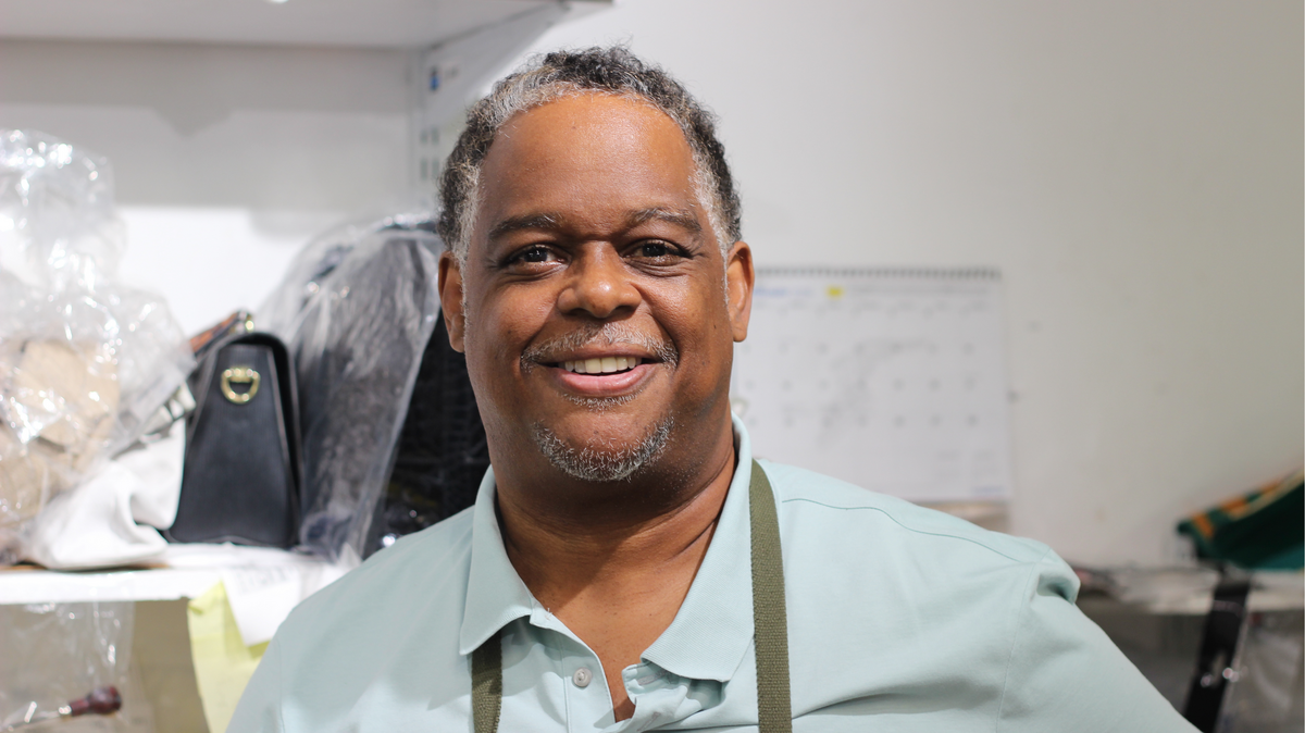 Chris Moore, 55, poses for a portrait photo in Artbag’s Coral Springs workshop.