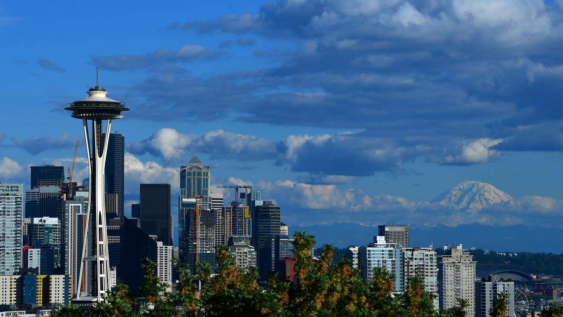 A general view of the Seattle Space Needle and downtown skyline with Mount Rainier in the background.