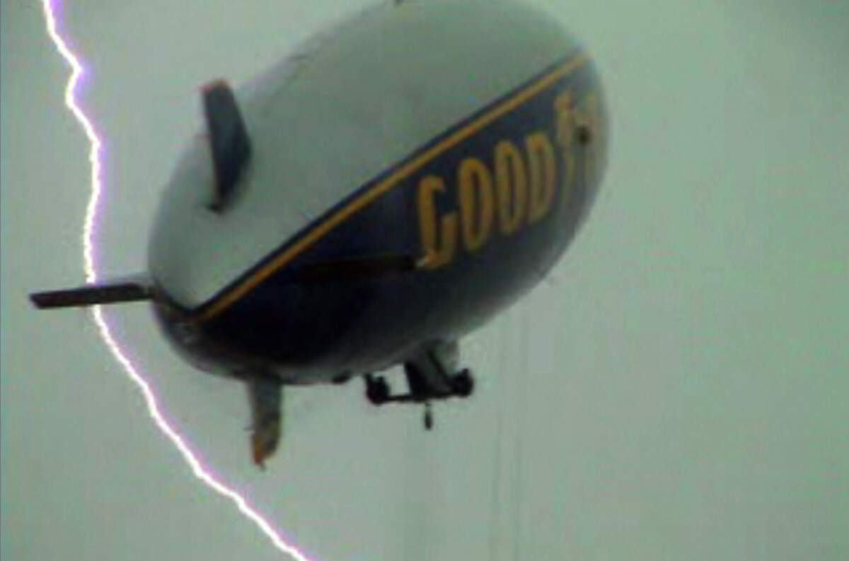 A still image taken from a home video showing the blimp moments before the crash, narrowly missed by a lightning bolt.