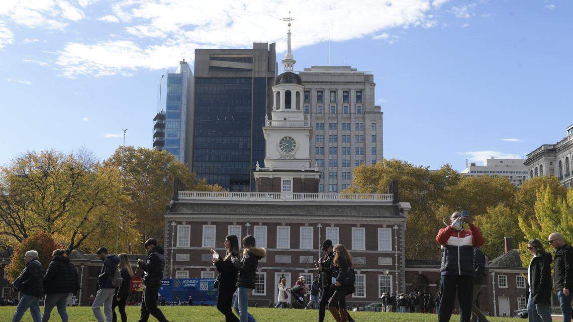 People pass Independence Hall on November 5, 2025 in Philadelphia, Pennsylvania.