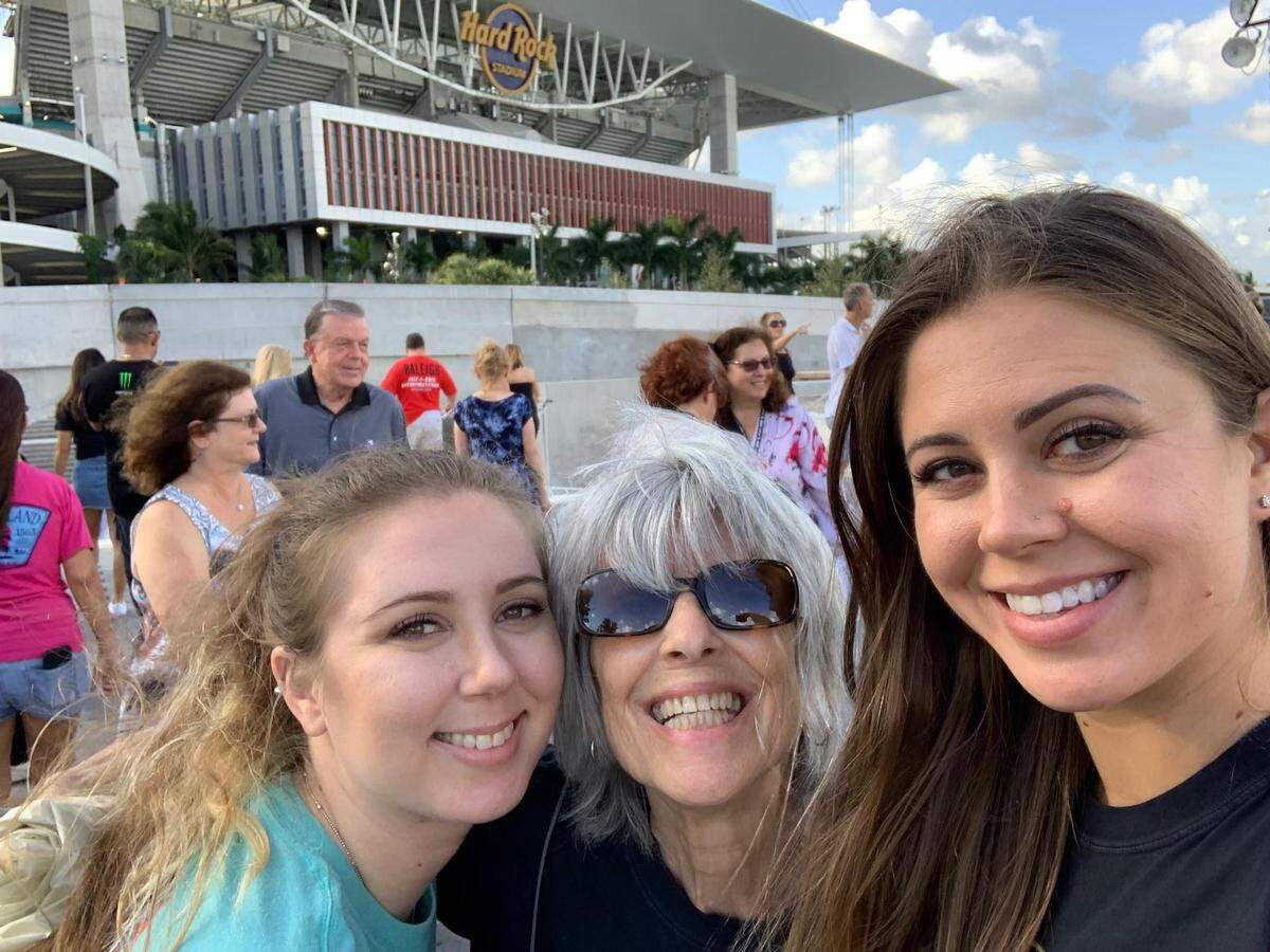 From left to right, Brittany, Rita and Jessica Lloyd take a selfie outside of Hard Rock Stadium before a Rolling Stones concert.