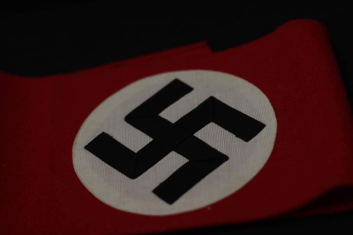 A preseverd Nazi armband, framed, is another item in the collection.