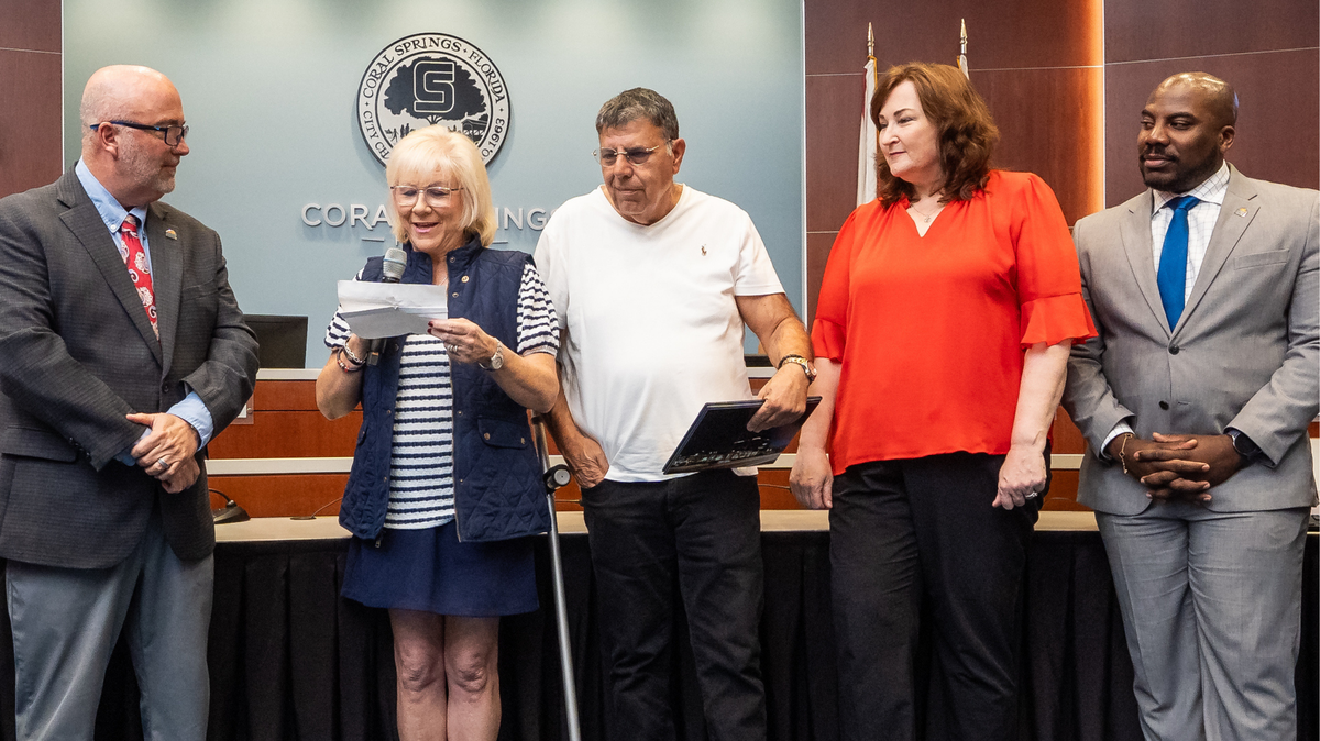From left to right, Commissioner Shawn Cerra, Beth Agami, Itzhak Agami, Representative Christine Hunschofski and Commissioner Joshua Simmons during the Coral Springs City Commission proclaimation honoring Daniel Agami.