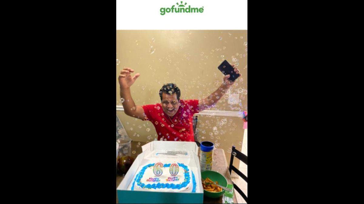 Franklin Osorio celebrates his 60th birthday with cake and bubbles.