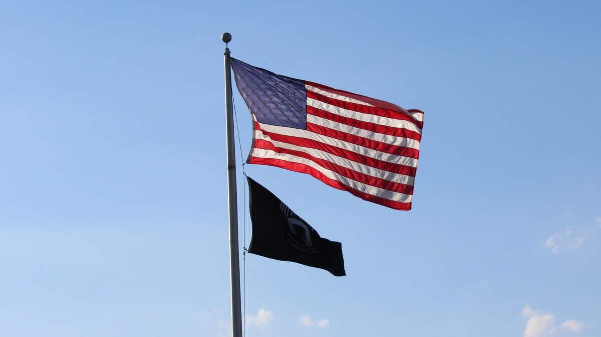 An American flag flies above the U.S. Post Office in Coral Springs on Feb. 4, 2025.
