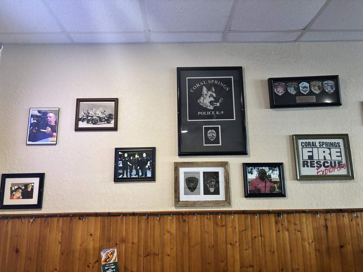 The walls of Wings Plus on Sample Road are adorned with old memorabilia.