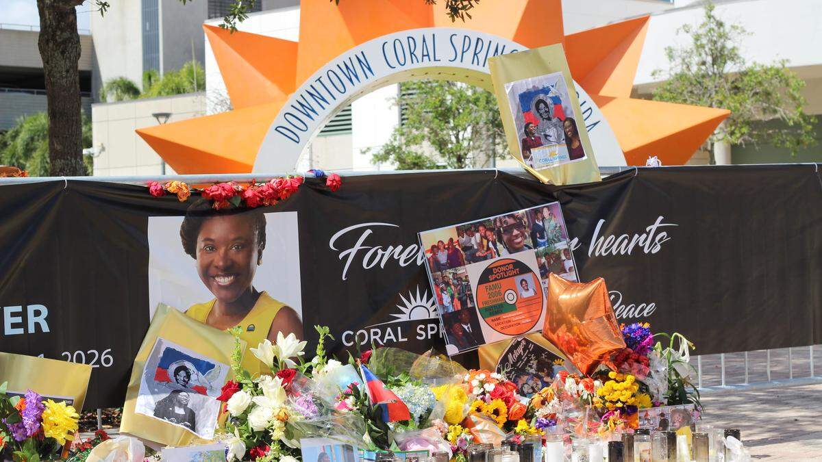 A memorial for Coral Springs Vice Mayor Nancy Metayer Bowen stands in front of City Hall on Monday, April 6, days after mourners packed the lawn for a vigil in her honor.