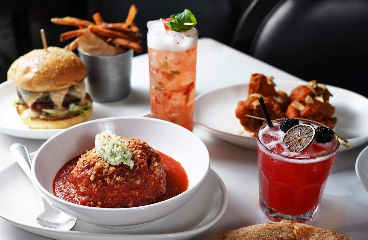 Happy hour dishes and drinks at Gary Rack’s Farmhouse Kitchen include burgers, wings and specialty cocktails.