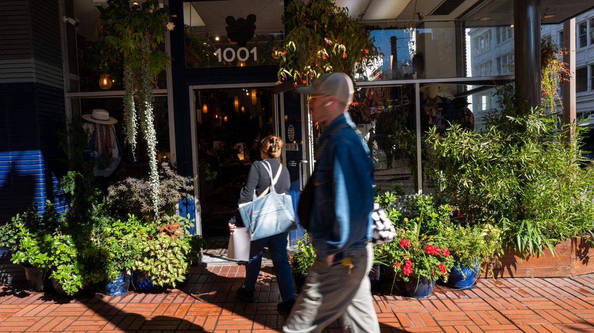 People walk through the downtown section in Portland, Oregon.