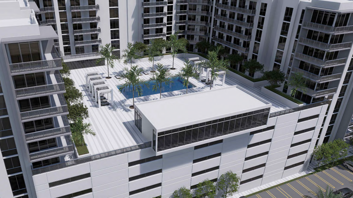 Developers are planning to build an 11-story apartment complex alongside a two-story commercial building on the property that currently houses a Bank of America drive-thru ATM at the corner of University Drive and NW 31st Court.