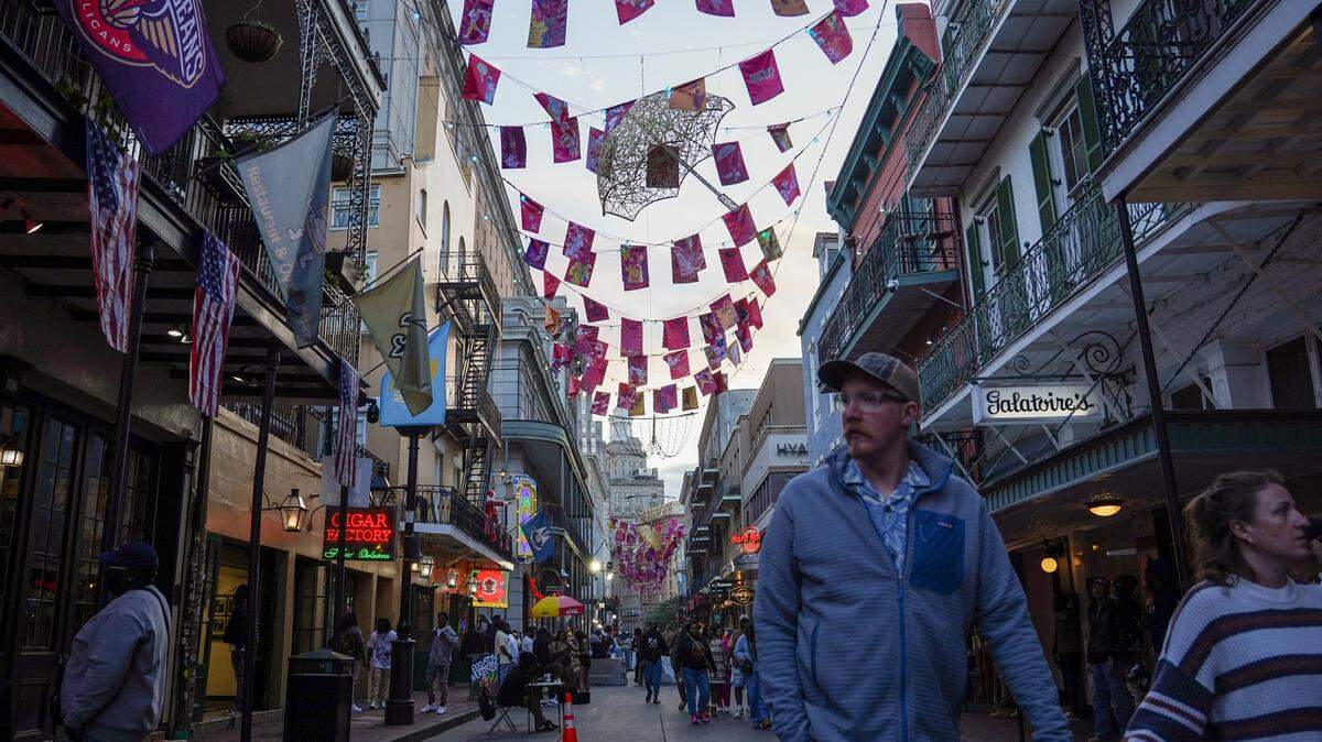 People walk on Bourbon Street on November 29, 2025 in New Orleans, Louisiana.