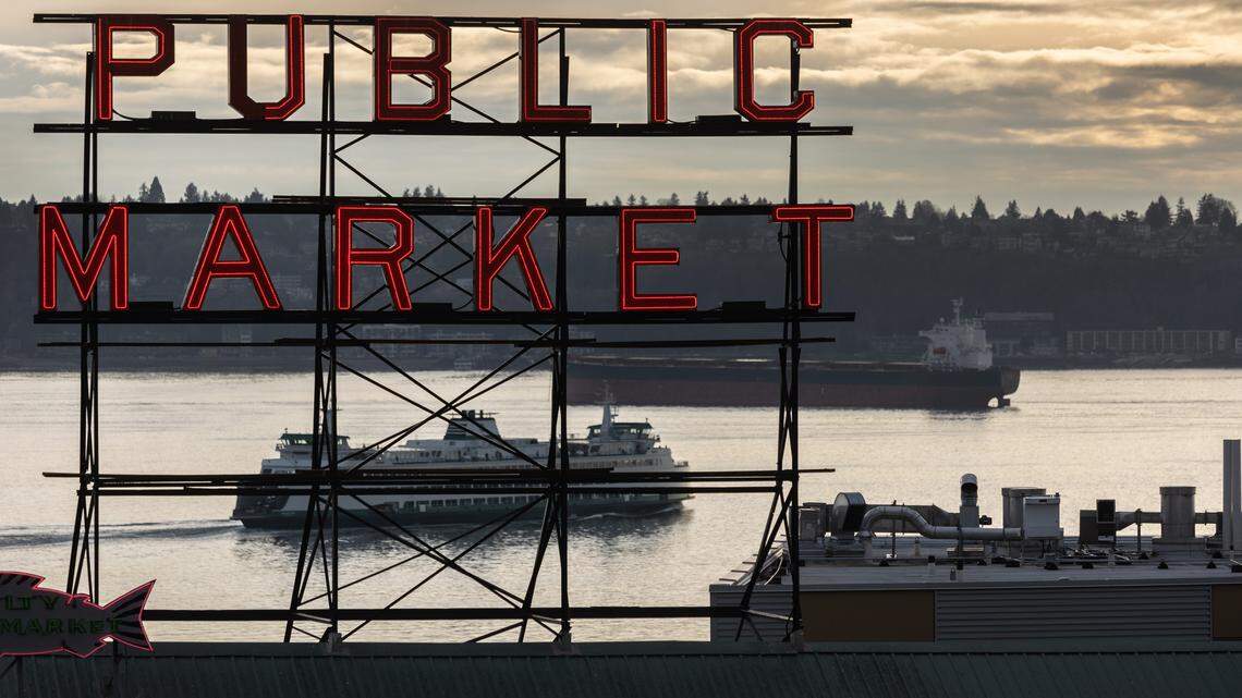 A ferry and a tanker pass through the Puget Sound near Seattle’s iconic Pike Place Market in Seattle, Washington.