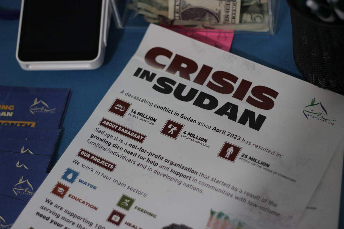 A flyer explains the humanitarian crisis in Sudan and what members of Sadagaat are doing to assist those struggling to survive in the country.