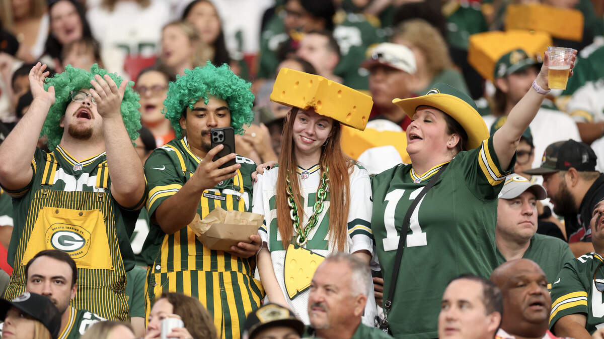 Green Bay Packers fans cheer in the second half of a game.