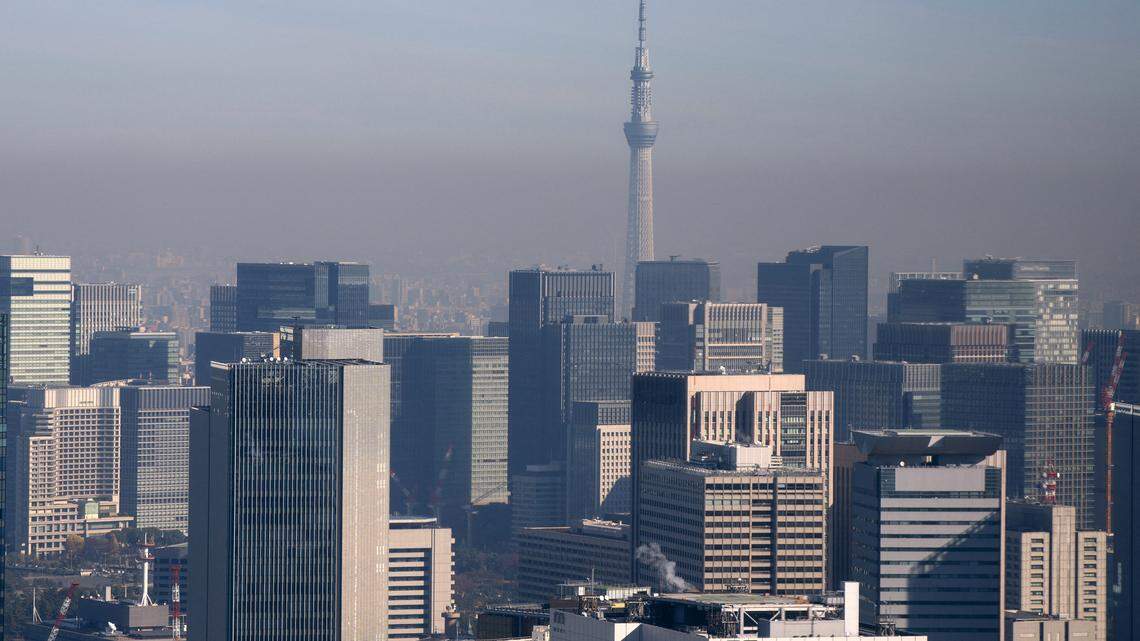 The Tokyo Skytree is seen past a cluster of high-rise buildings in Tokyo’s business district.