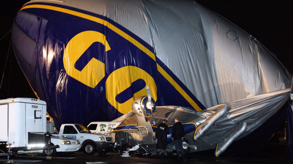 The Stars & Stripes Goodyear blimp sits on a building after it crash-landed in an industrial park in Coral Springs in June 2005. The two people aboard were trapped inside while electrical crews cleared the site but no one was injured.