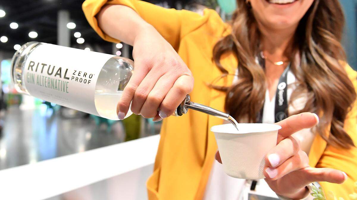 A Ritual Zero Proof representative pours a sample of nonalcoholic gin.