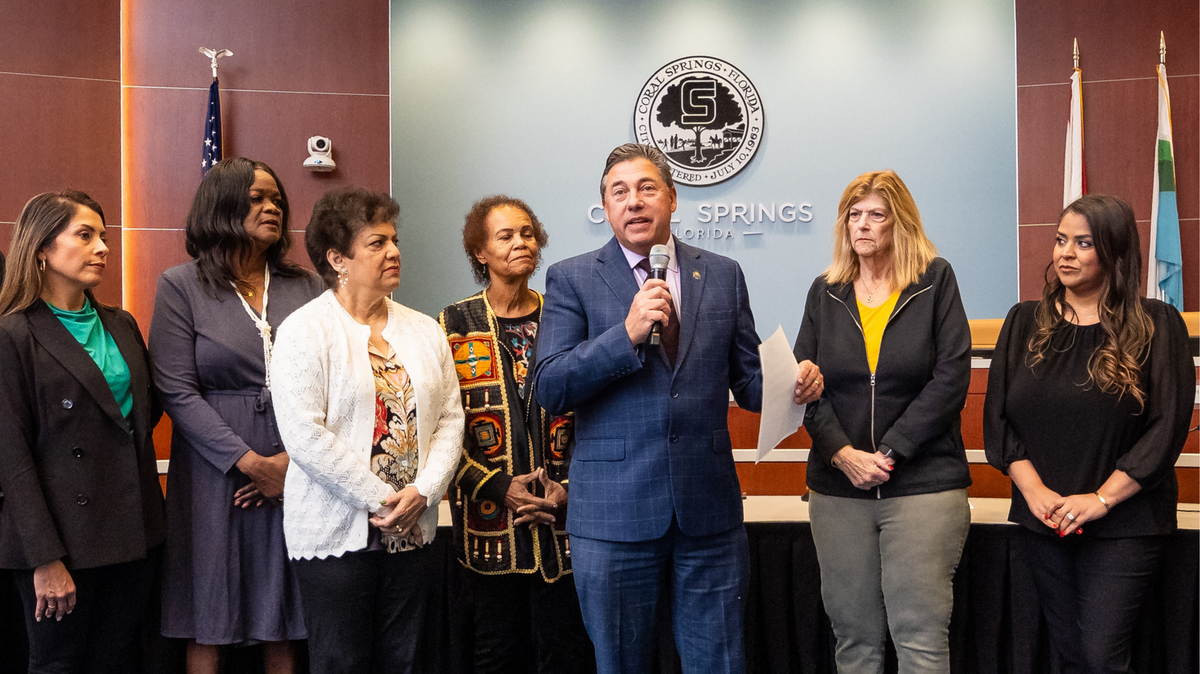 Coral Springs Mayor Scott Brook, center, speaks about the Martin Luther King Jr. Committee during the Feb. 4 City Commission meeting.