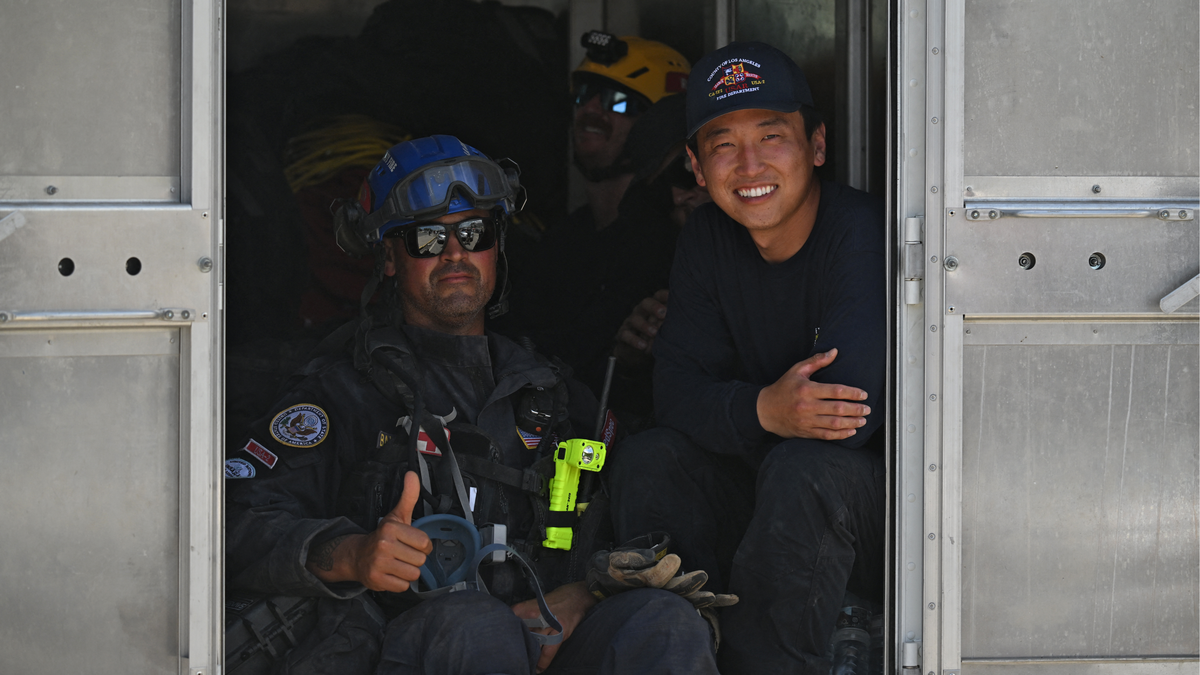 Rescue workers in Caraballeda, La Guaira State, Venezuela, on June 29 following twin earthquakes.