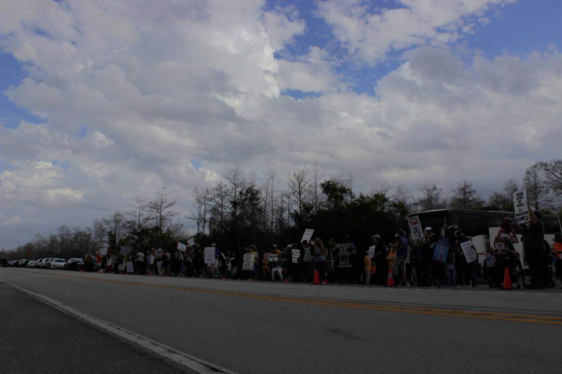 Organizers said the turnout at the weekly vigil held outside Alligator Alcatraz was higher than expected on March 1, with rows of people holding signs and chanting as vehicles entered and exited the facility.