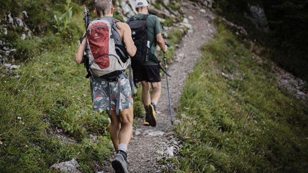 Two hikers on a trail.