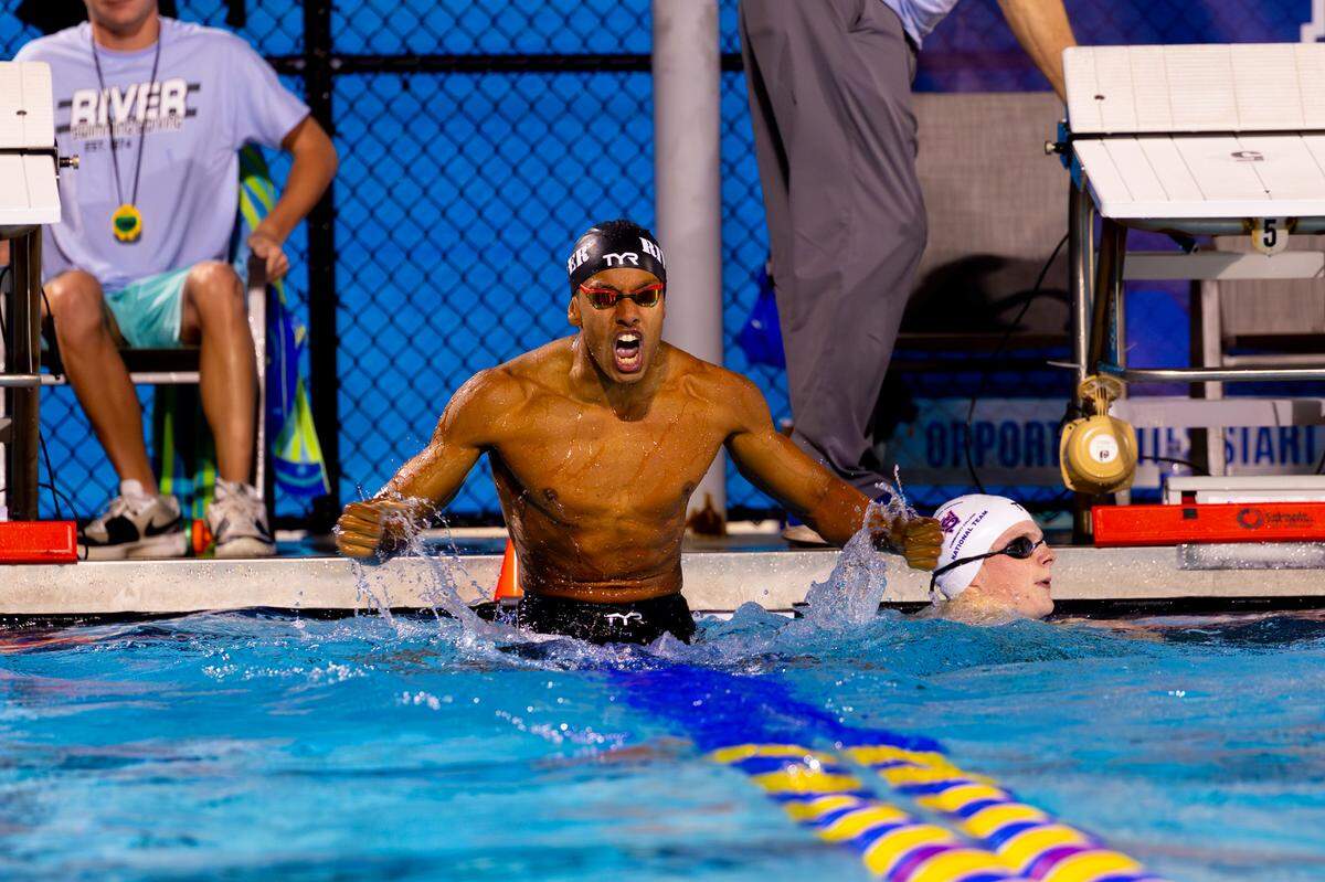 Marcus Johnson celebrates after breaking the 100-yard breaststroke record he set earlier that day during the National Junior College Athletics Association National Championships on March 5.