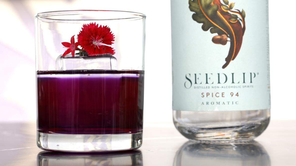 Seedlip beverage on display next to bottle.