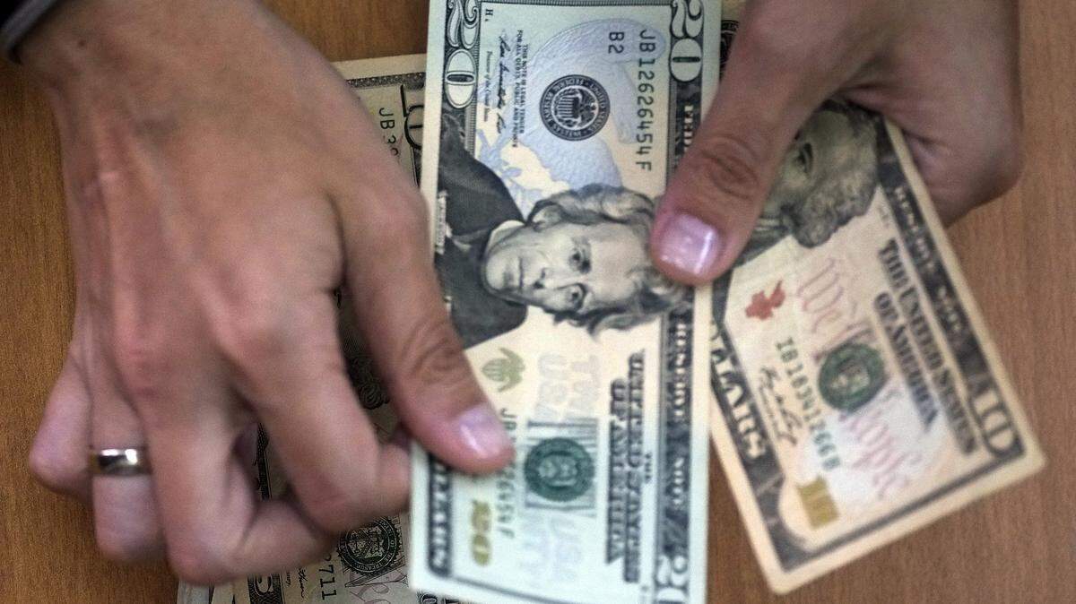 Hands counting American money