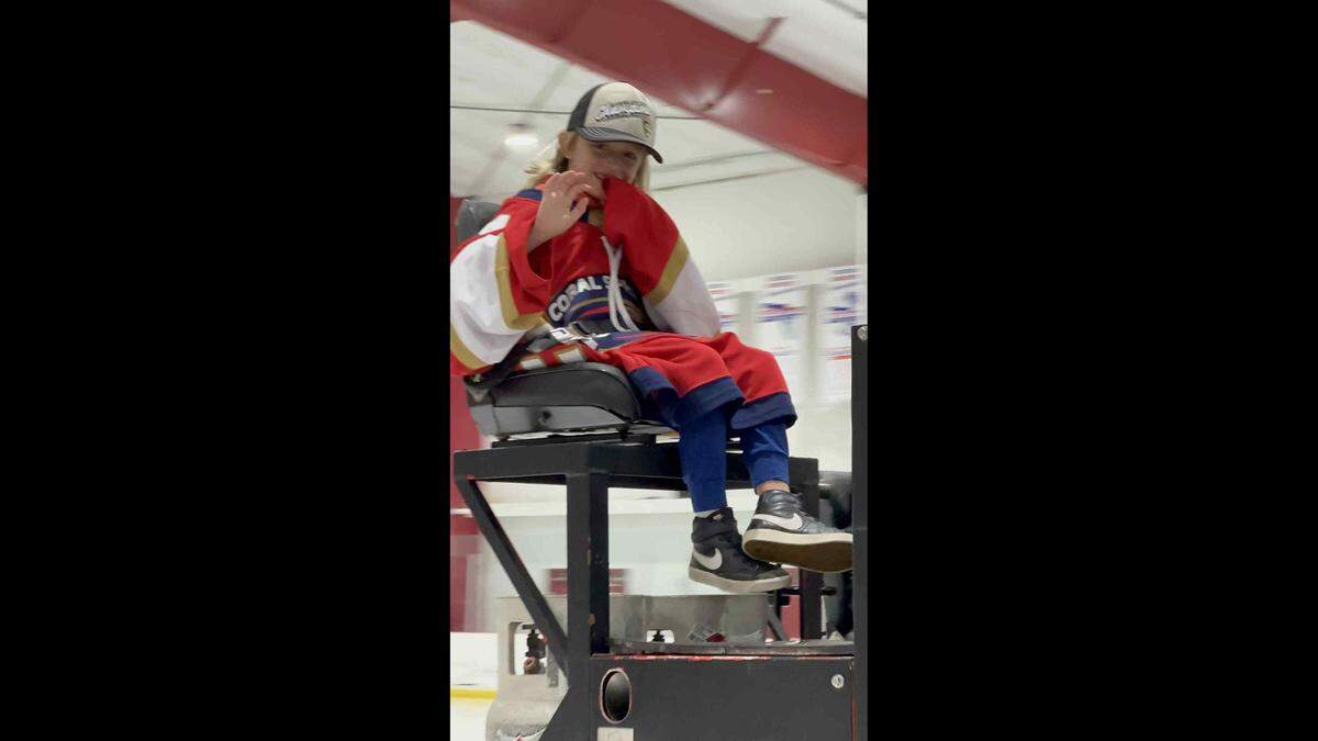 LJ Howells rides a Zamboni at the Florida Panthers Ice Den.