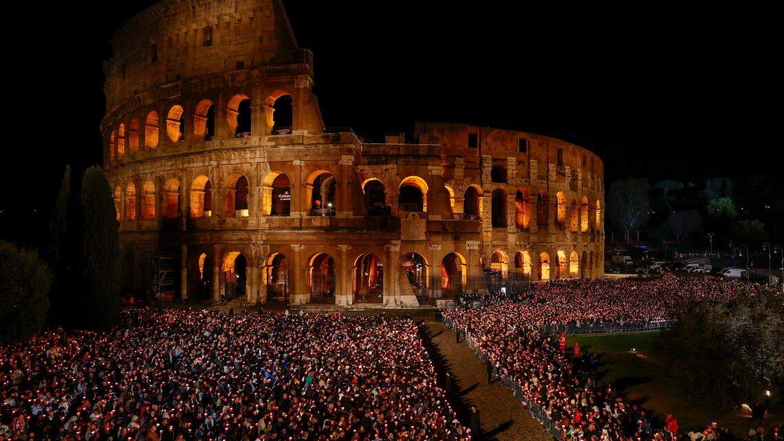People gather outside the Colosseum as they attend the Via Crucis (Way of the Cross) procession presided over by Pope Leo XIV during Good Friday celebrations, in Rome, Italy.