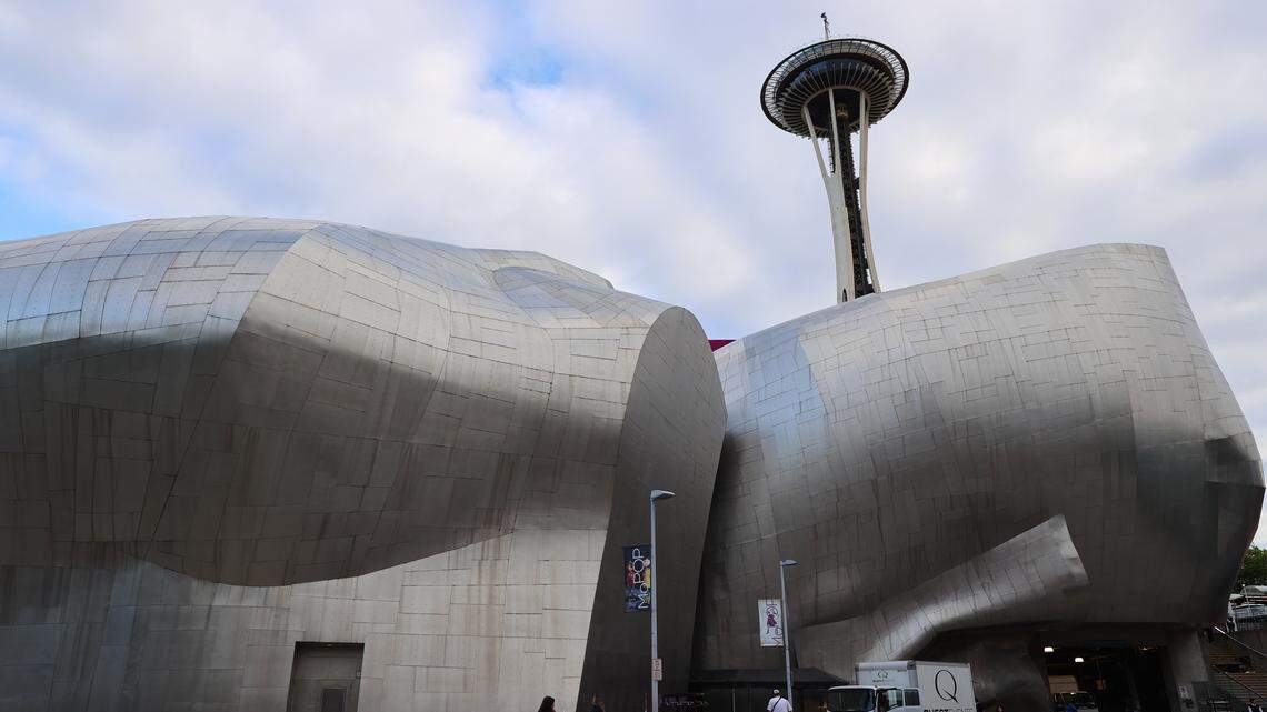 The outside of the Museum of Pop Culture with the Space Needle in the background in Seattle, WA.