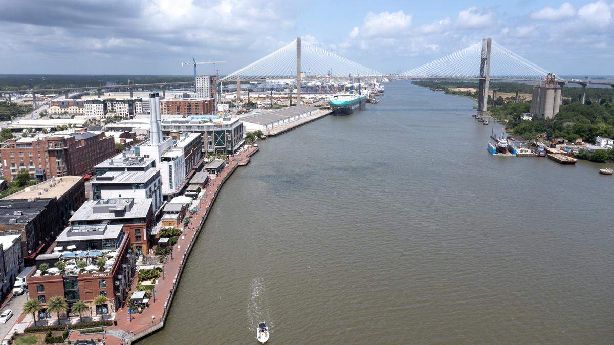 An aerial photo of the Historic Downtown waterfront with the Talmadge Memorial Bridge in the background on May 12, 2023 in Savannah, Georgia.