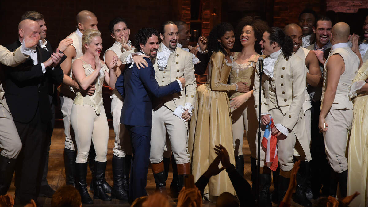 Music director Alex Lacamoire and actor, composer Lin-Manuel Miranda and cast of “Hamilton” celebrate on stage the receiving of a GRAMMY award