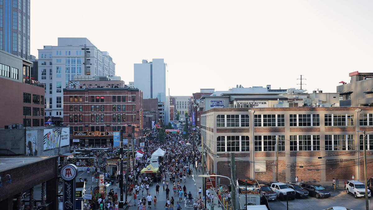 An overhead view of summer concert attendees filling the streets in Nashville.