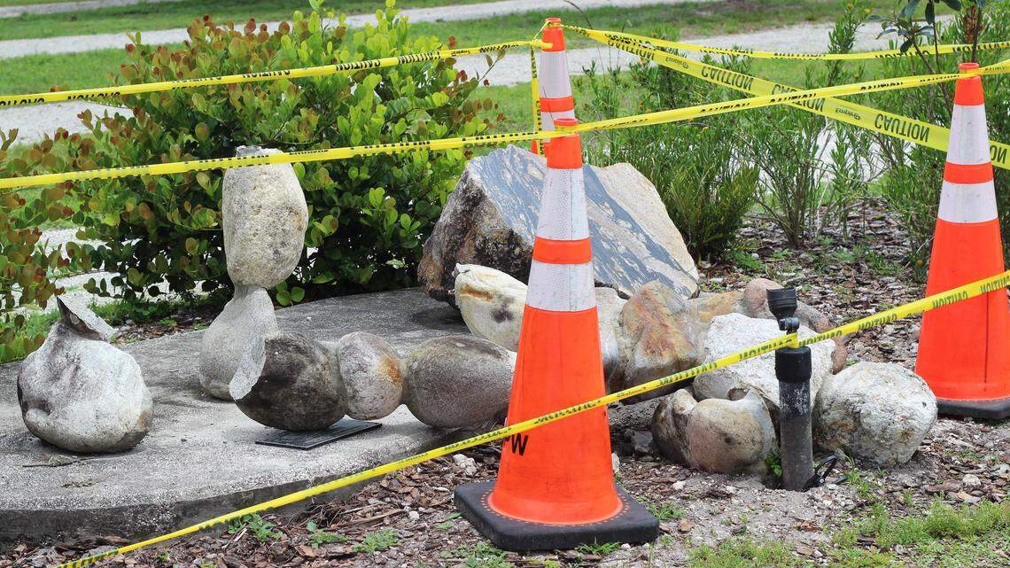 Craig Berube-Gray’s Rock-et Man sculpture lies surrounded by caution tape in Whispering Woods Park on Tuesday, April 21.