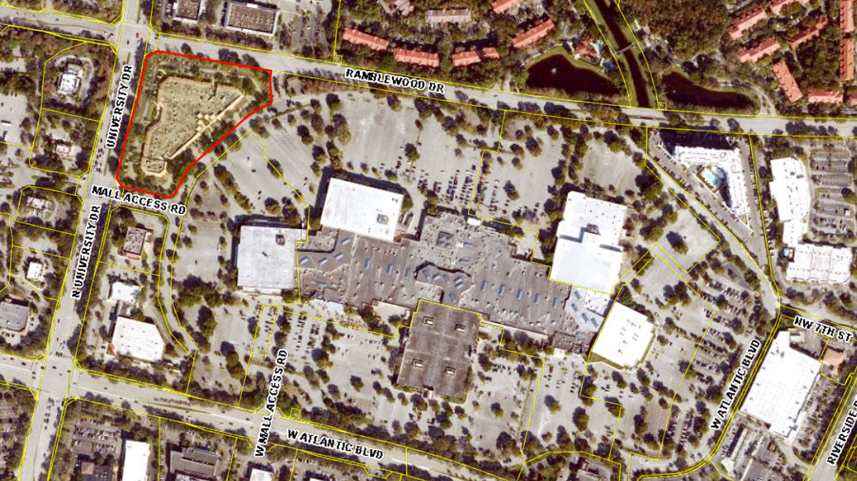 A plaza located at the corner of University Drive and Ramblewood Drive has been sold and billed as “Coral Square Future Development Site II,” records show.