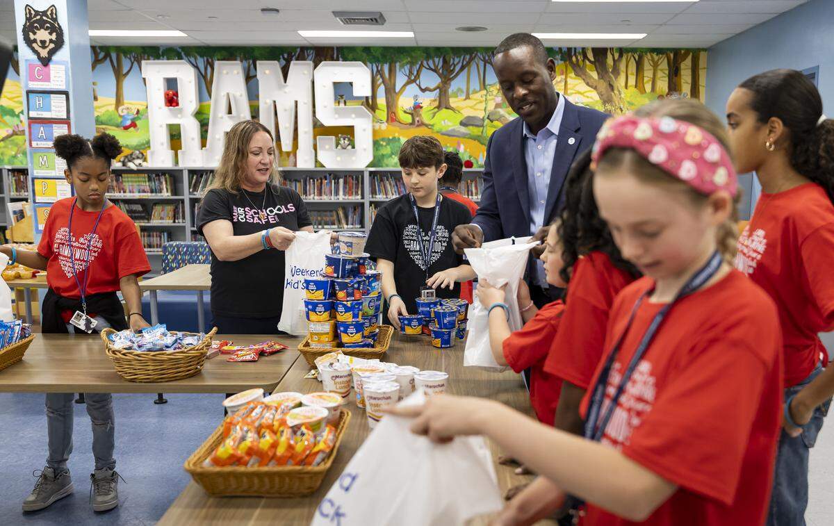 School Board Member Lori Alhadeff and Broward County Schools Superintendent Howard Hepburn help students prepare Weekend Packs for children in need as Ramblewood Elementary School participates in a day of commemoration honoring the victims of the Marjory Stoneman Douglas High School tragedy on Friday, Feb. 13, in Coral Springs.
