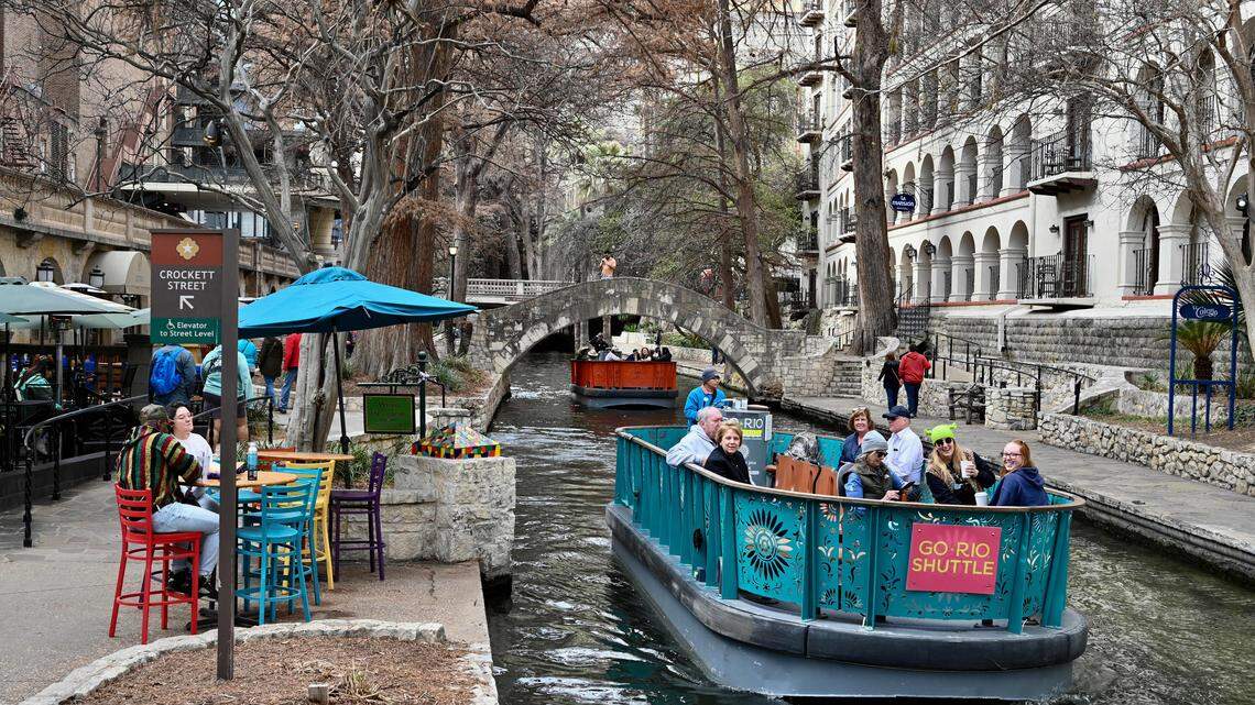 Tourists enjoy a River Walk boat cruise along the San Antonio River, in downtown San Antonio Texas.